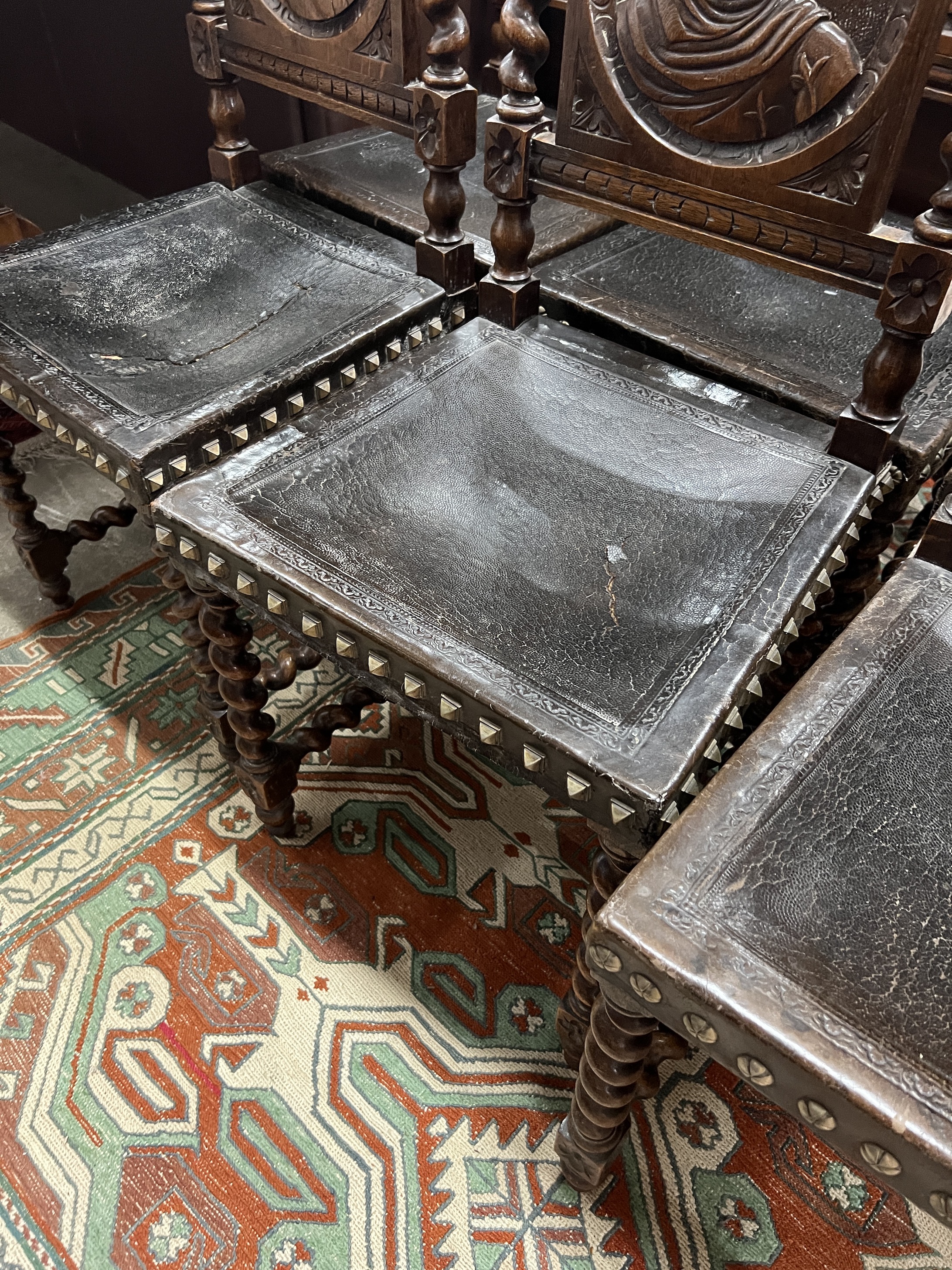 A set of six late 19th century Flemish carved oak dining chairs